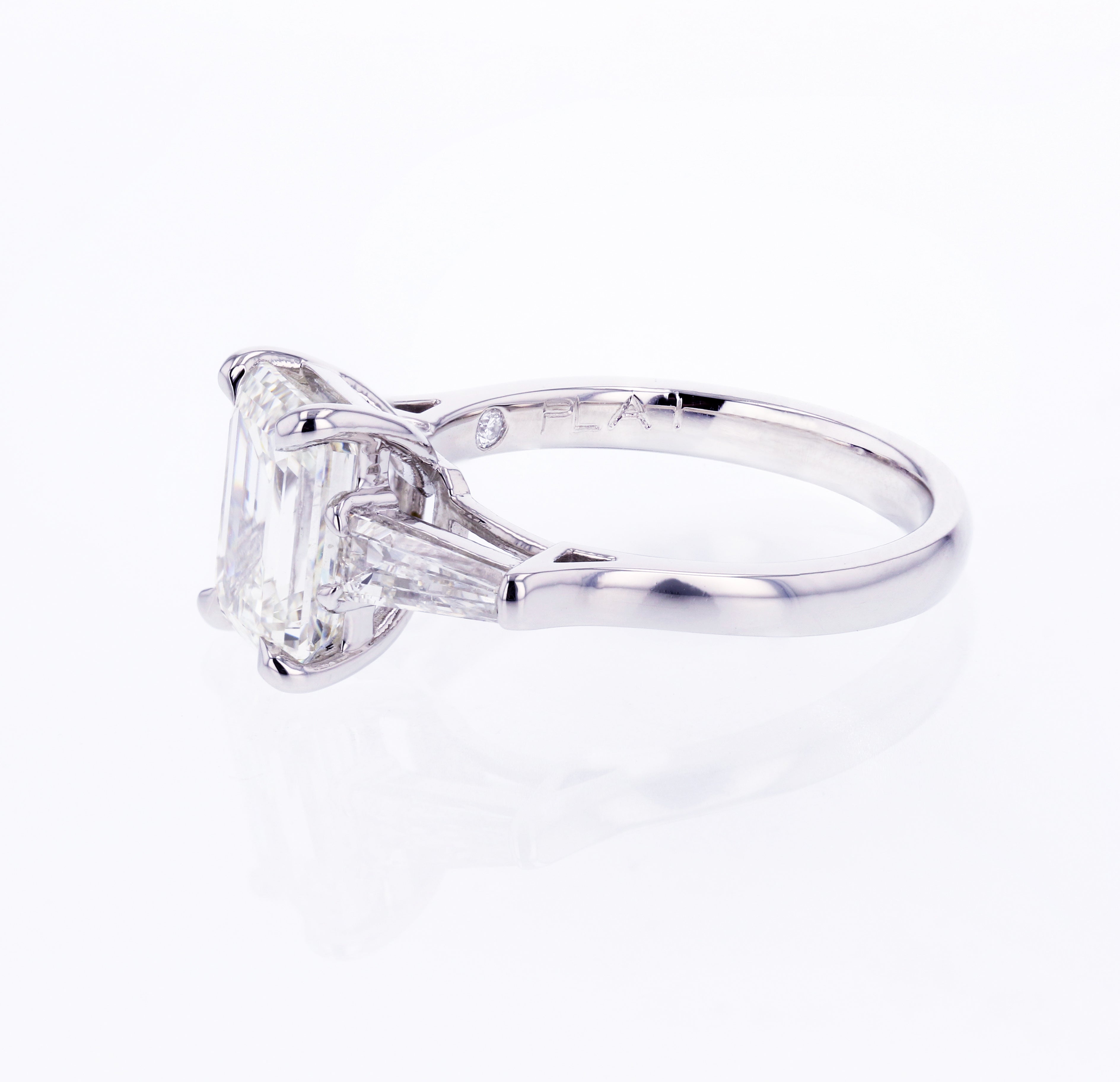 Three-stone Emerald Engagement Ring